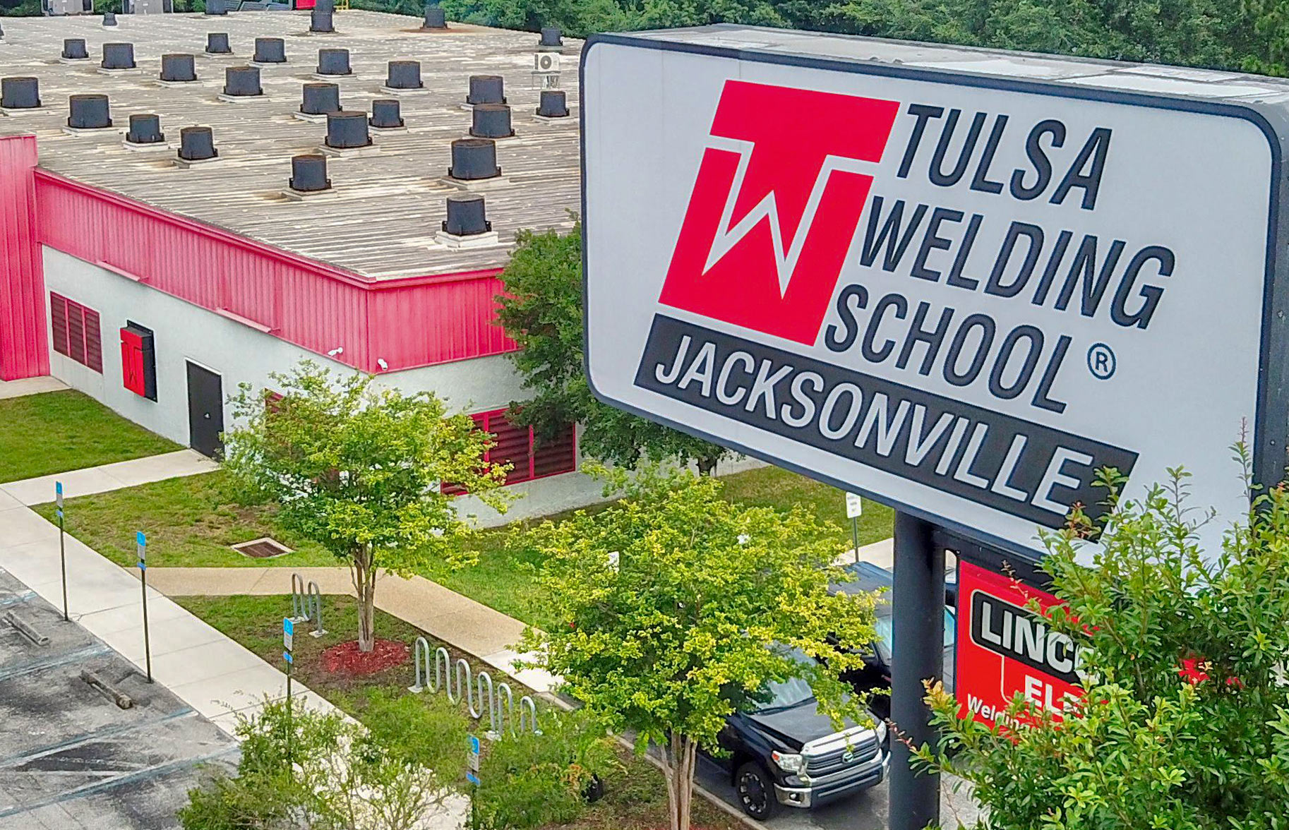 Aerial shot of TWS Jacksonville campus building and sign in Jacksonville, FL