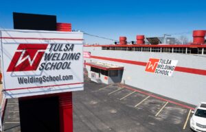 Aerial shot of Tulsa Welding School campus building and sign in Tulsa, OK